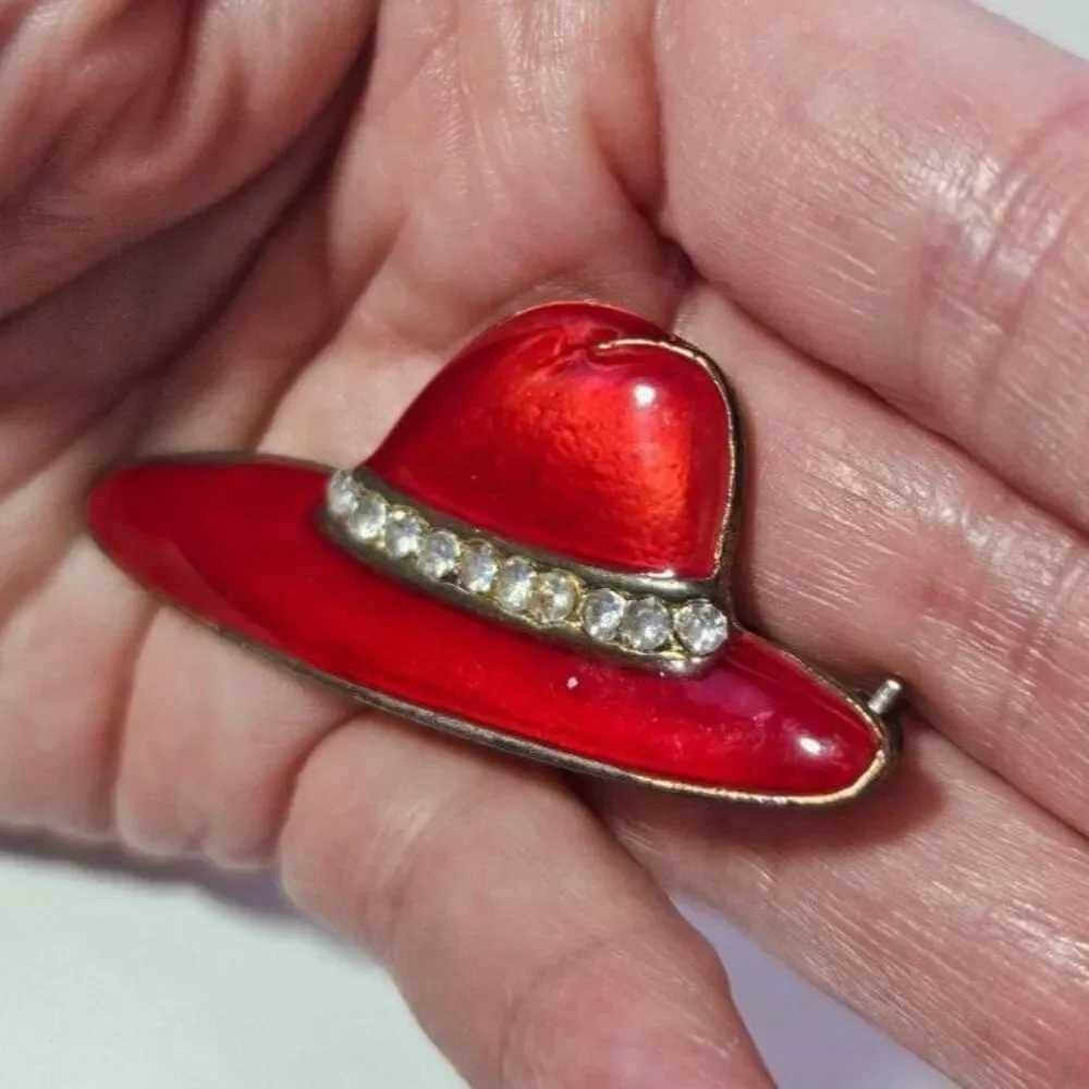 Gold tone red hat society brooch